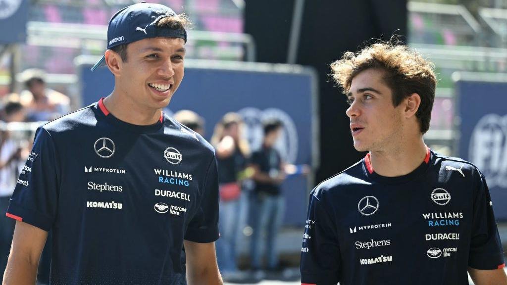 Williams drivers Alex Albon and Franco Colapinto pictured in conversation before the 2024 Azerbaijan Grand Prix